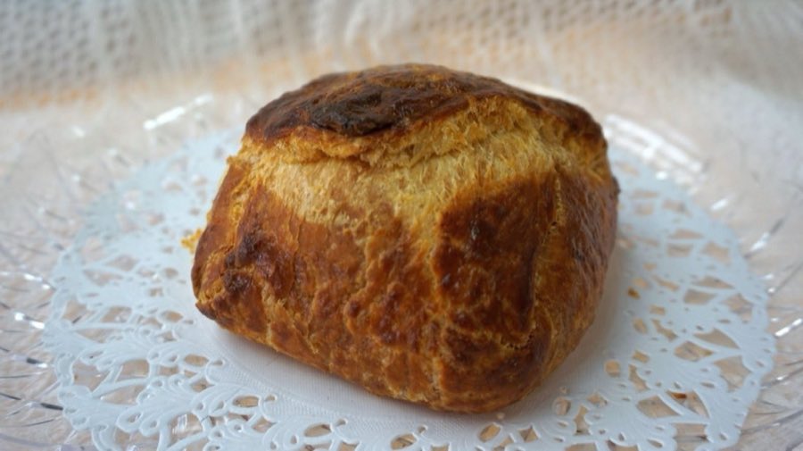 Beigli roll cake on a paper doily
