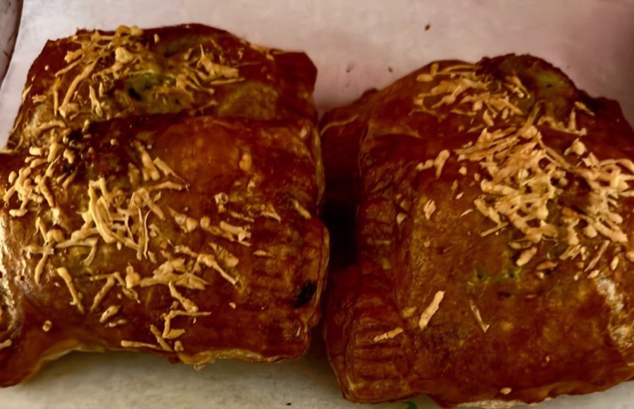 Two large pastries topped with shredded coconut