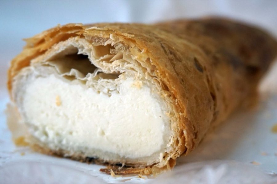 Cream-filled rolled pastry, cut open