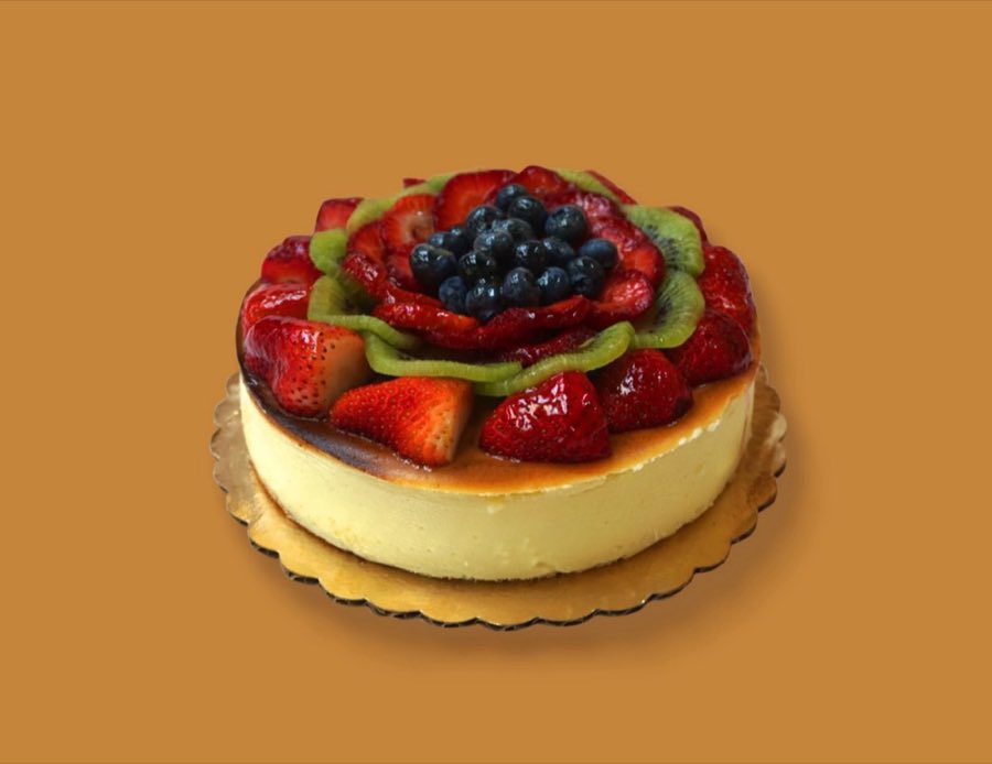 Fruit tart topped with strawberry, blackberry, and kiwi
