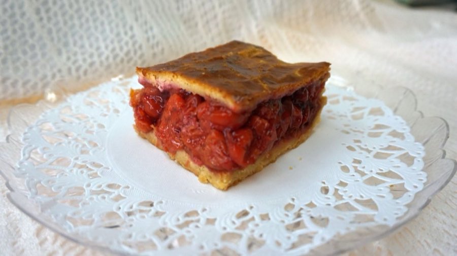 Linzer tart cookie dusted with powdered sugar