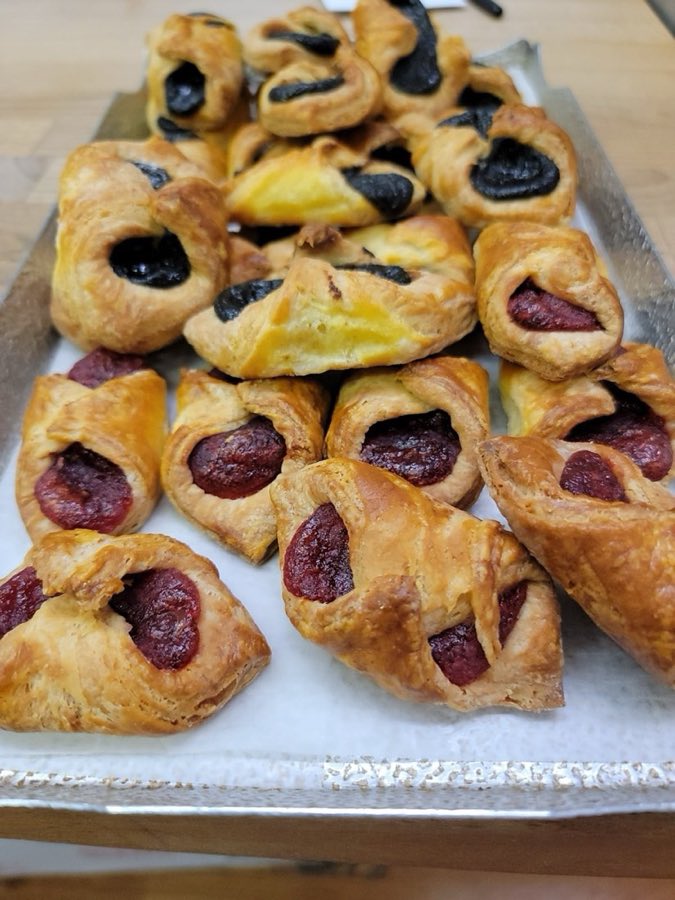 Tray of poppyseed and fruit filled pastry pockets