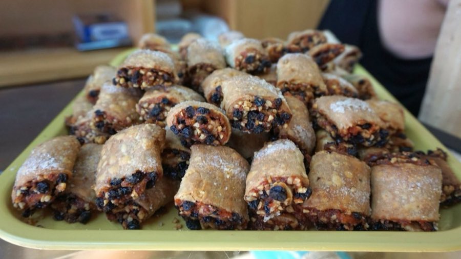 Tray of rugelach dusted with powdered sugar