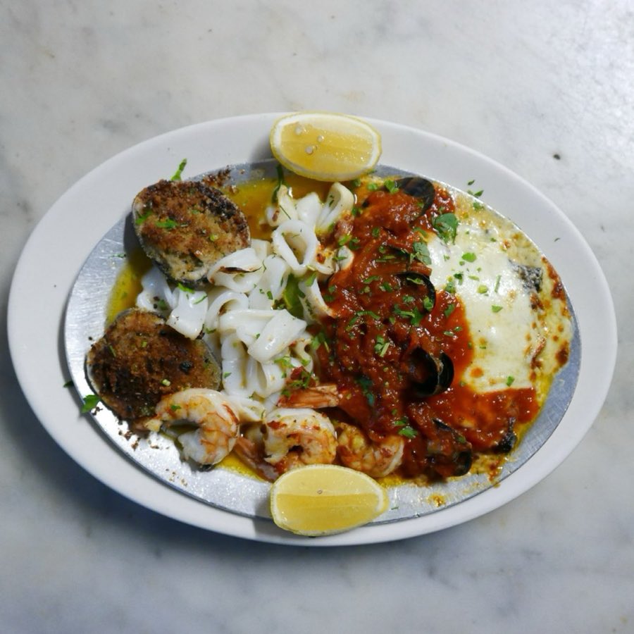 Baked clams casino style with lemon
