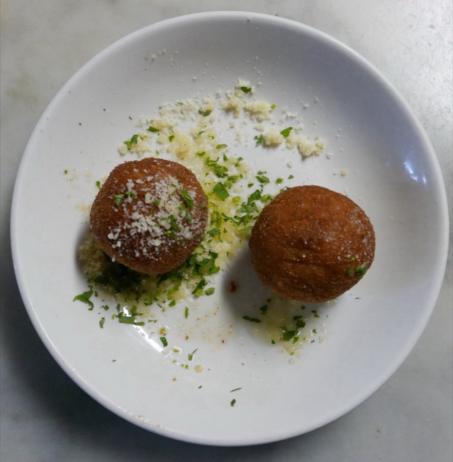 Meatballs in red sauce garnished with parsley