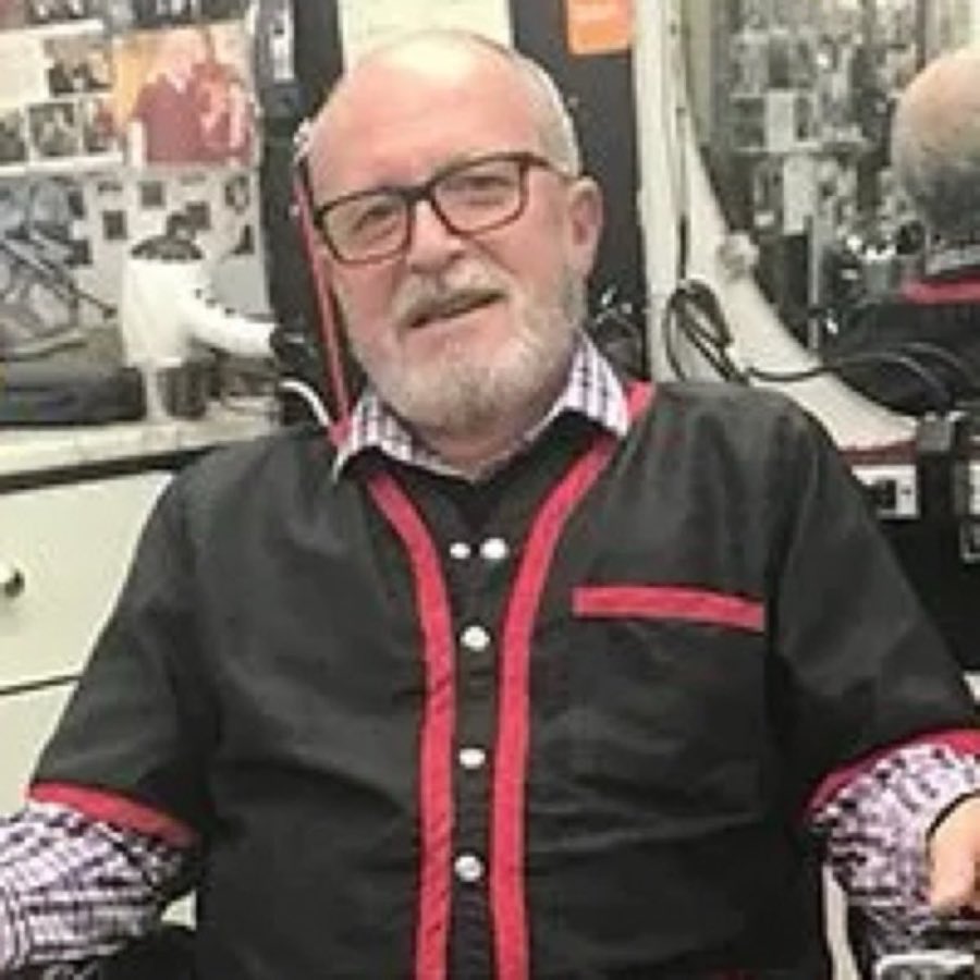 Portrait of barber Luigi in the shop