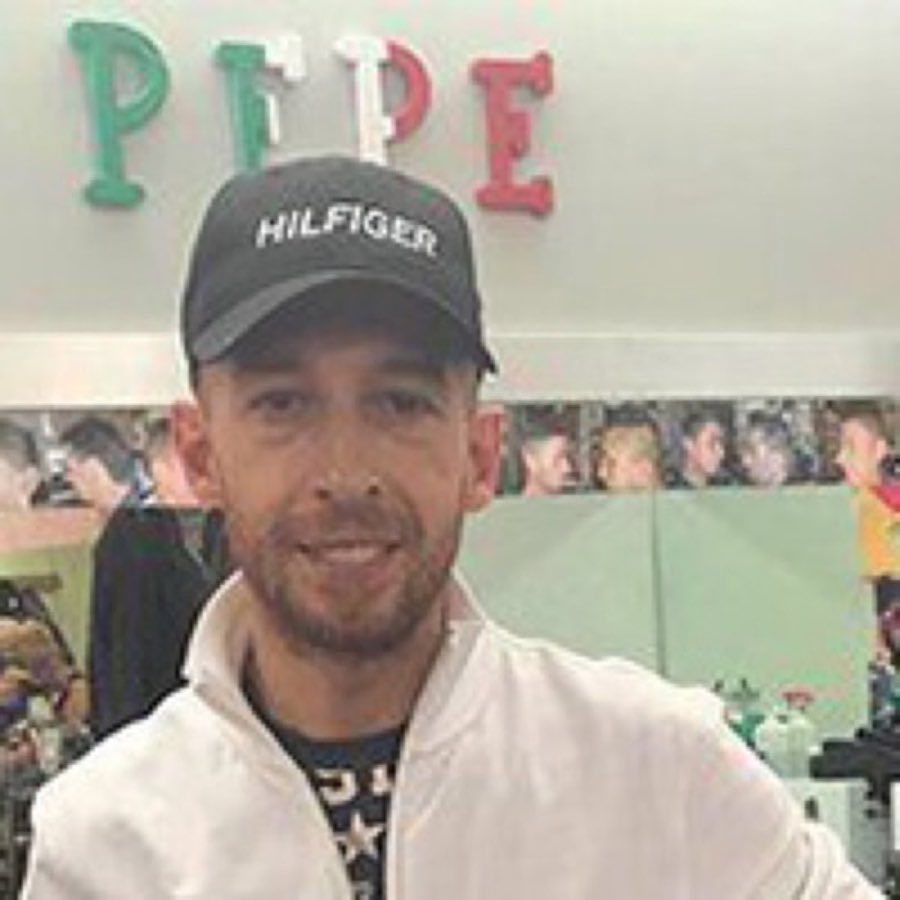 Portrait of barber Pepe in the shop