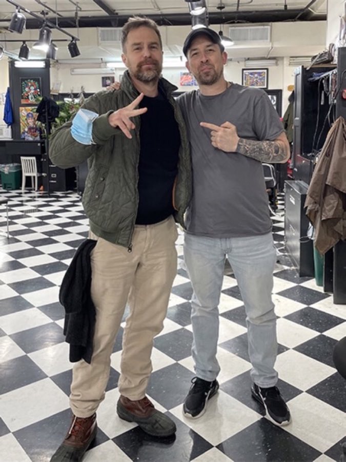 Photo from the shop wall of a customer identified as Sam Rockwell