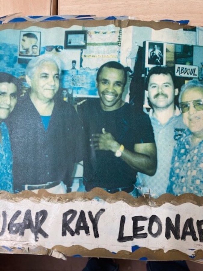 Photo from the shop wall of a customer identified as boxing champion Sugar Ray Leonard
