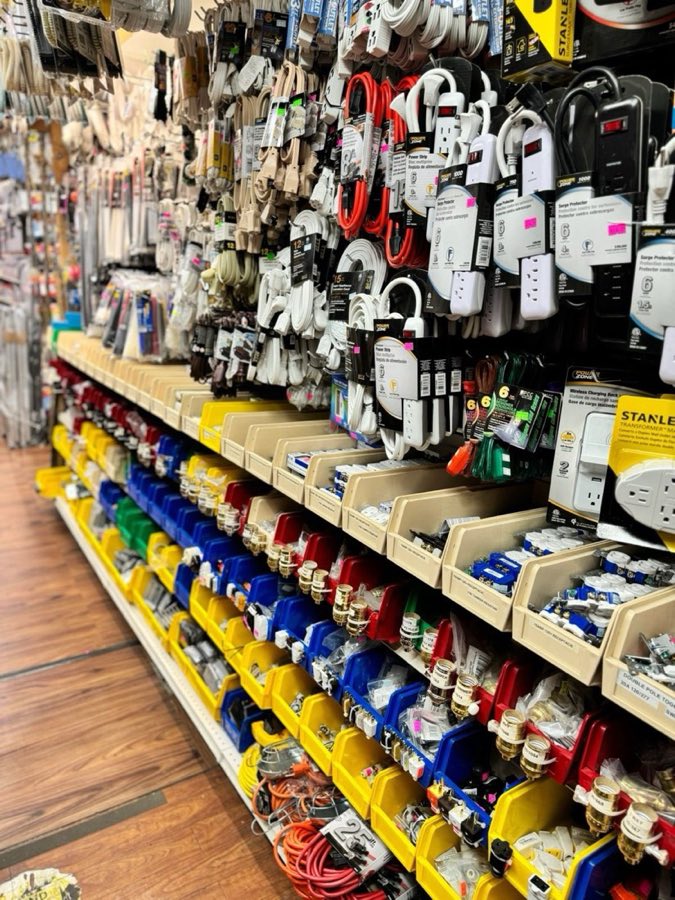 Aisle of extension cords, surge protectors, and light sockets