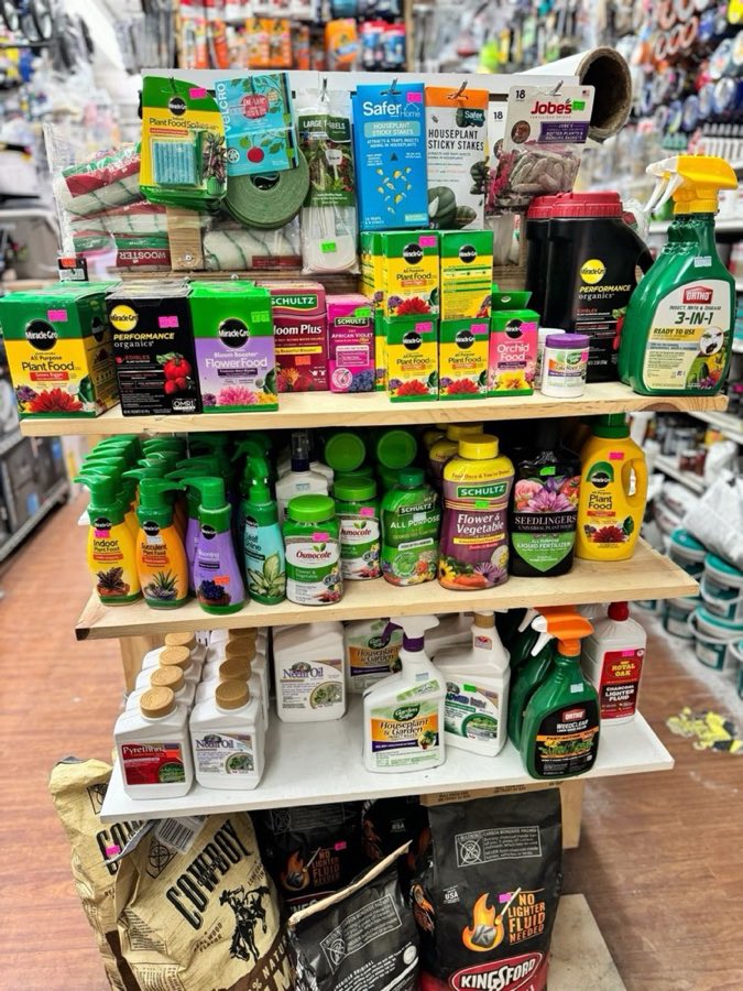 Garden and plant-care aisle with fertilizer, pest control, and potting supplies