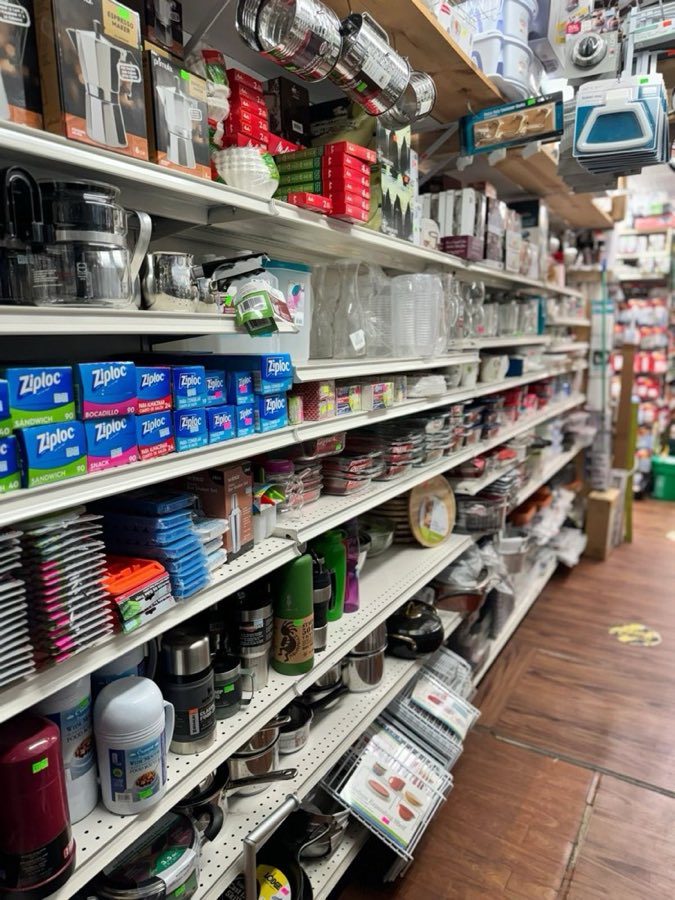 Housewares aisle with espresso makers, glassware, and kitchen storage