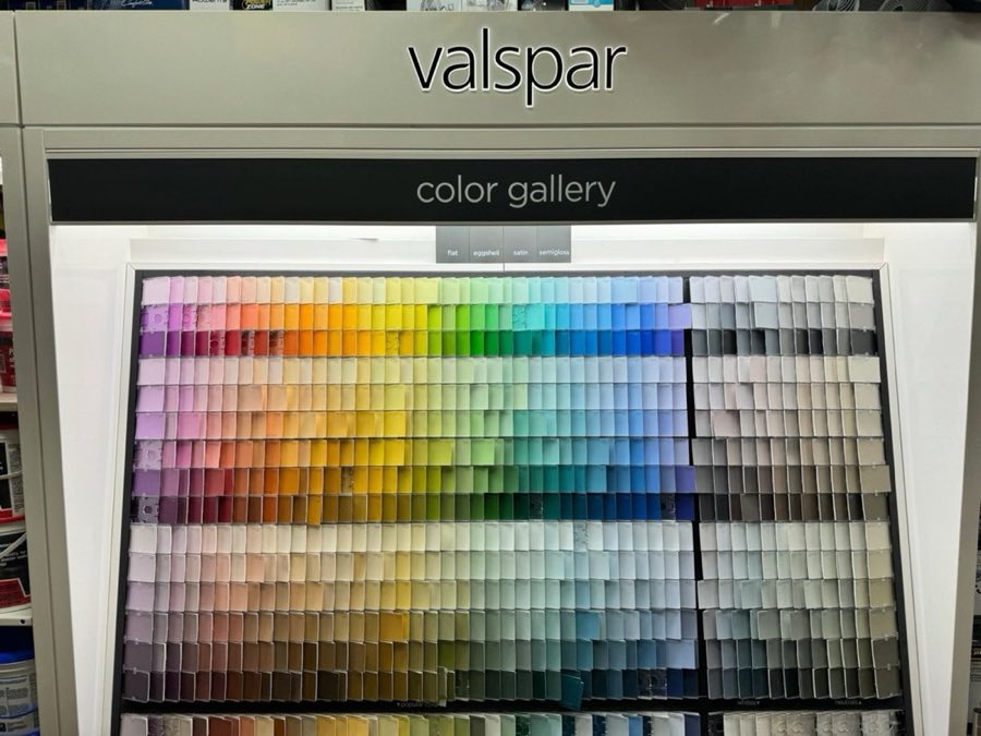 Valspar paint color gallery wall with hundreds of paint chips arranged by hue