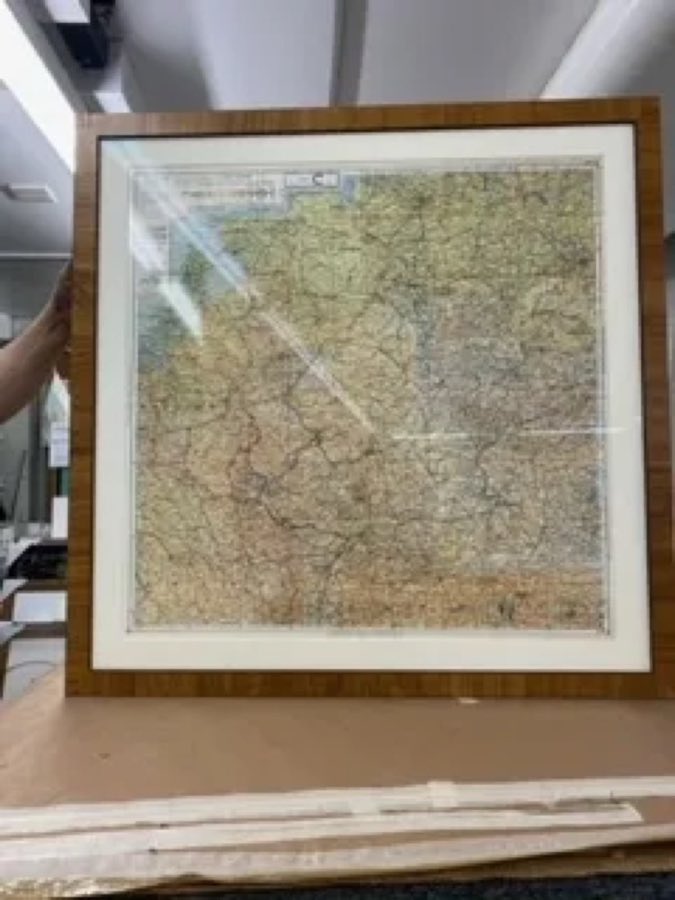 A vintage map, custom-framed in a wood frame