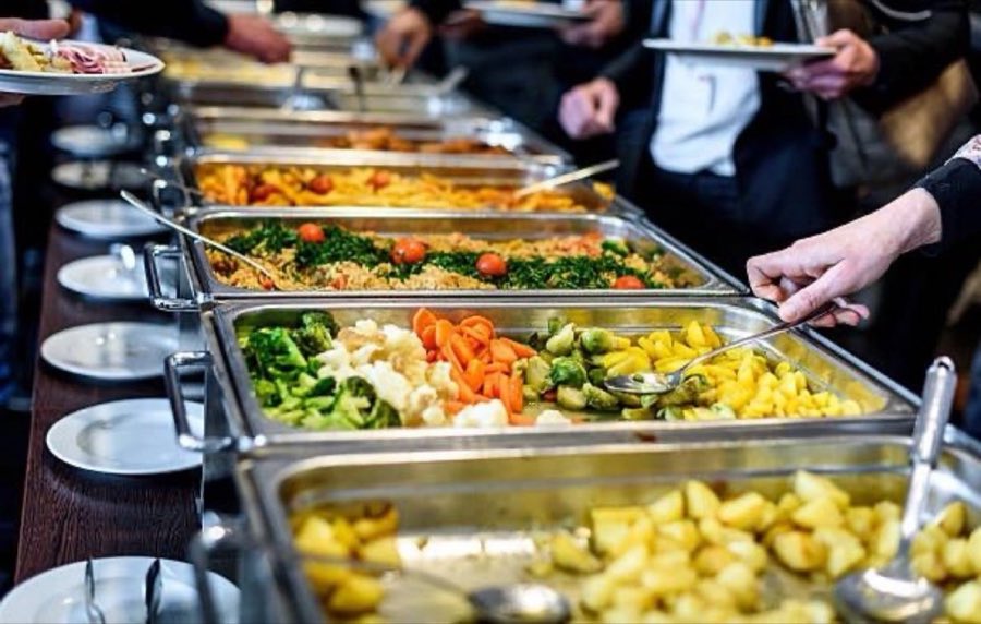 Editorial-style photograph of a buffet catering line, used here as decorative texture