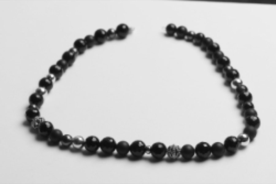 The same necklace after restringing, ultrasonic cleaning, and restoration