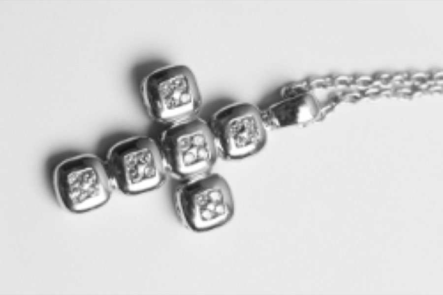 The same pendant chain after cleaning and repair, restored to like-new condition