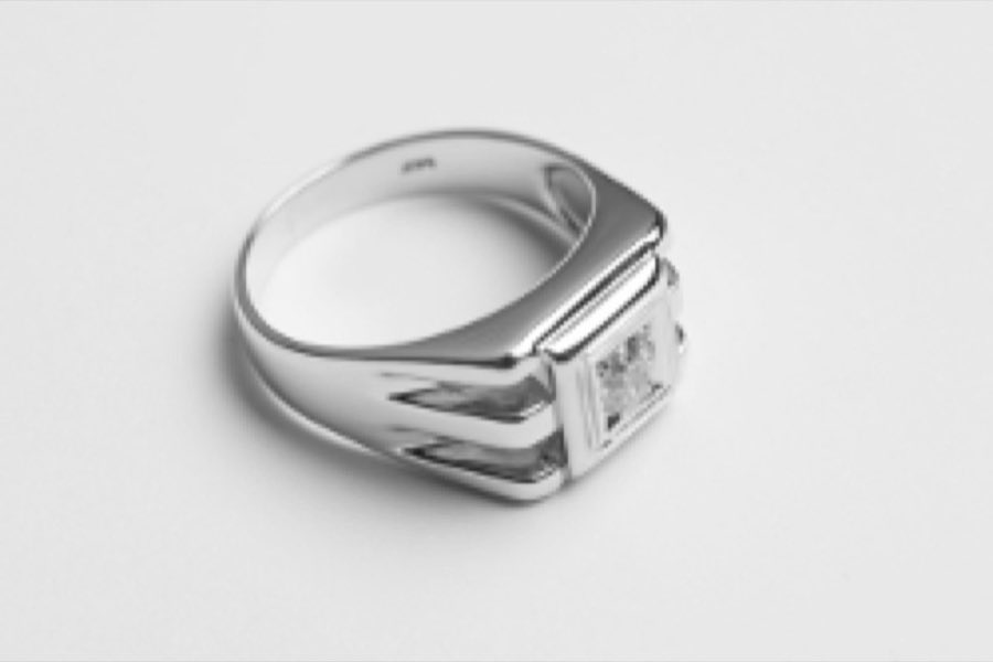 The same ring restored, polished, and reset with a new diamond, after repair