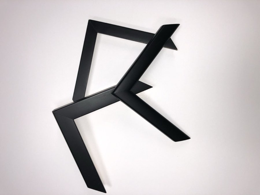 Three plain black frame corner samples arranged on a white background