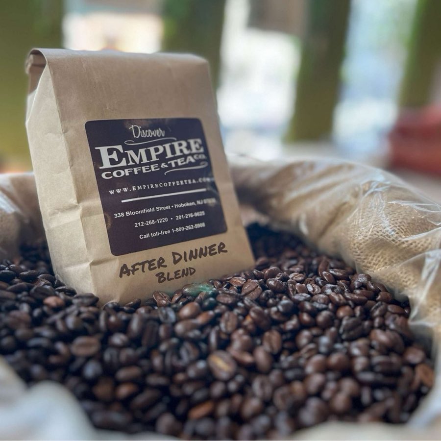 A kraft-paper Empire Coffee & Tea Co. bag labeled After Dinner Blend, resting in a burlap sack of whole roasted coffee beans
