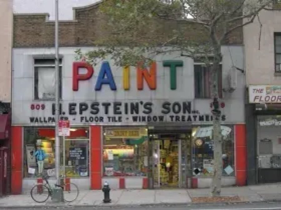 Epstein's storefront with a bold rainbow-lettered PAINT sign and red columns on a New York City street
