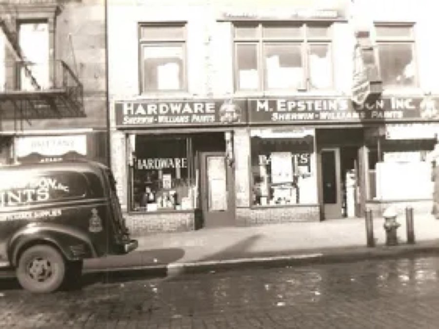 Vintage black-and-white photograph of the original M. Epstein's Son hardware and Sherwin-Williams paint storefront, with a period delivery truck parked outside