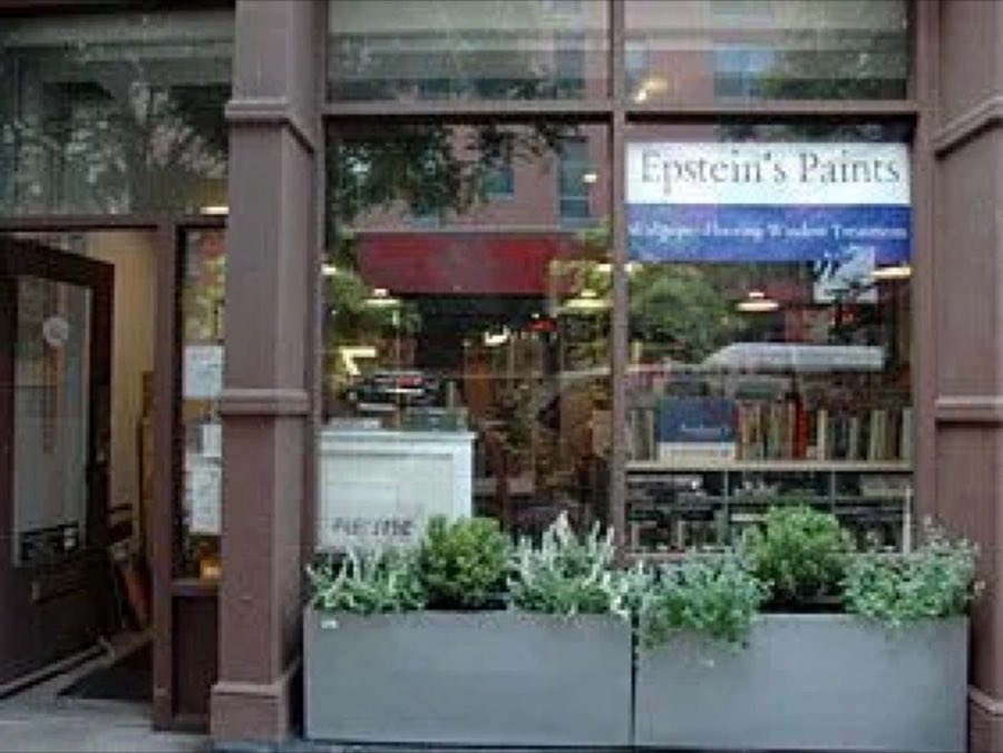 Recent photo of the Epstein's Paints storefront window with planters out front