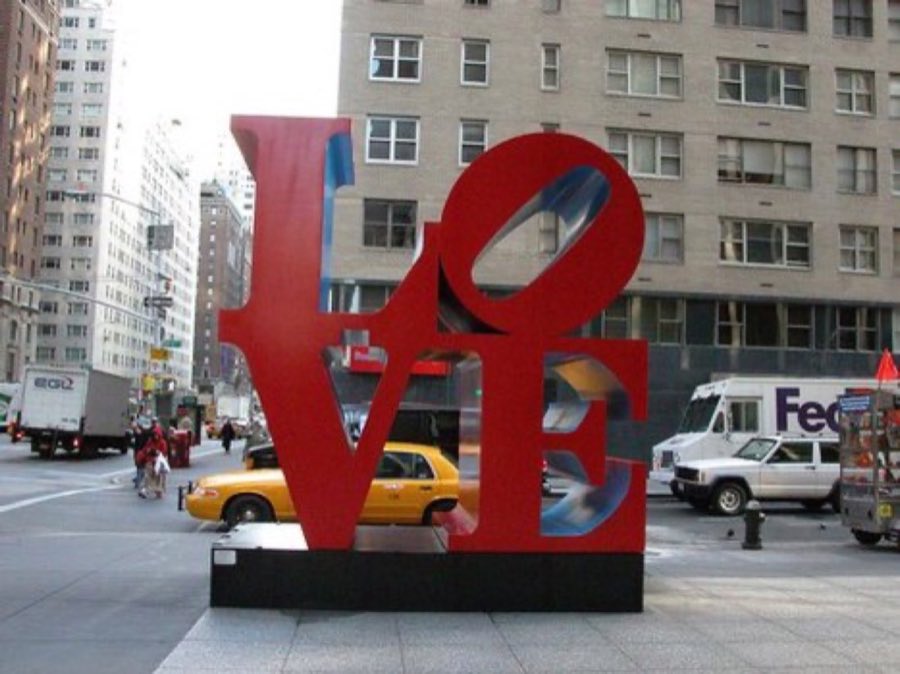 The red LOVE sculpture on a Manhattan street corner near the store