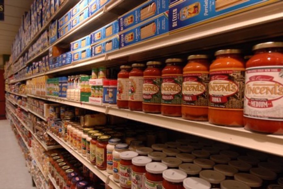 Aisle stocked with pasta and pasta sauces