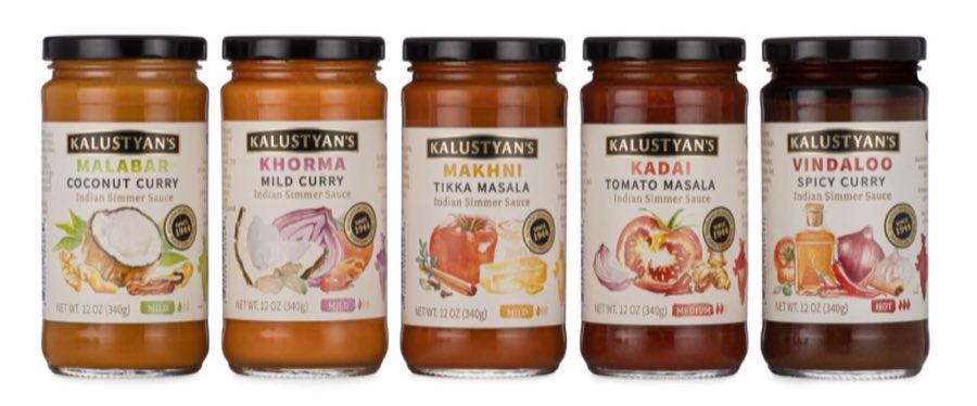 Five jars of Kalustyan's Indian Simmer Sauce lined up: Malabar coconut curry, Khorma mild curry, Makhni tikka masala, Kadai tomato masala, and Vindaloo spicy curry, each marked Est. 1944