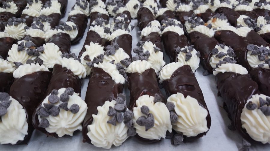 Rows of chocolate-dipped cannoli