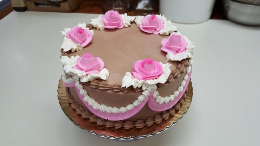 Chocolate cake with pink frosting roses