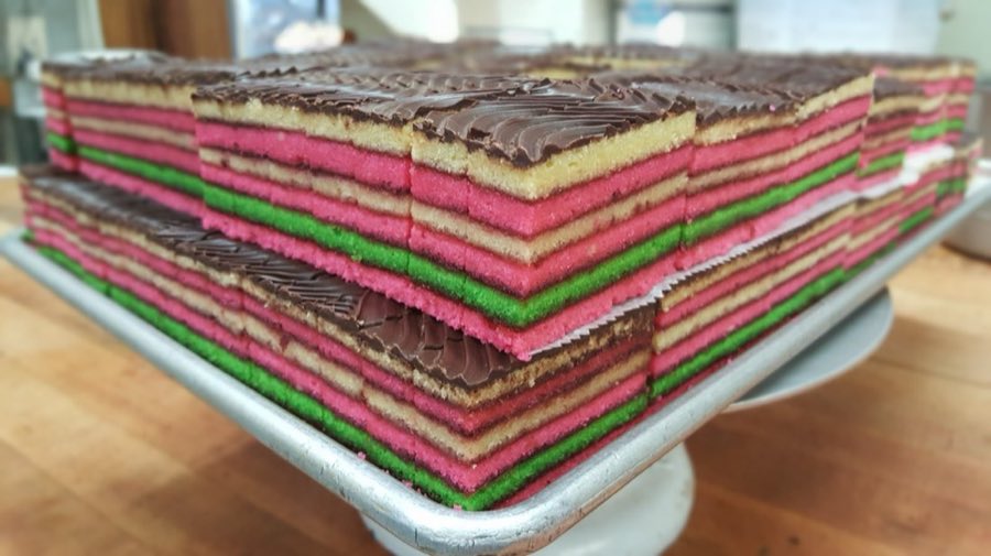 Rainbow cookies layered in pink, green, and chocolate