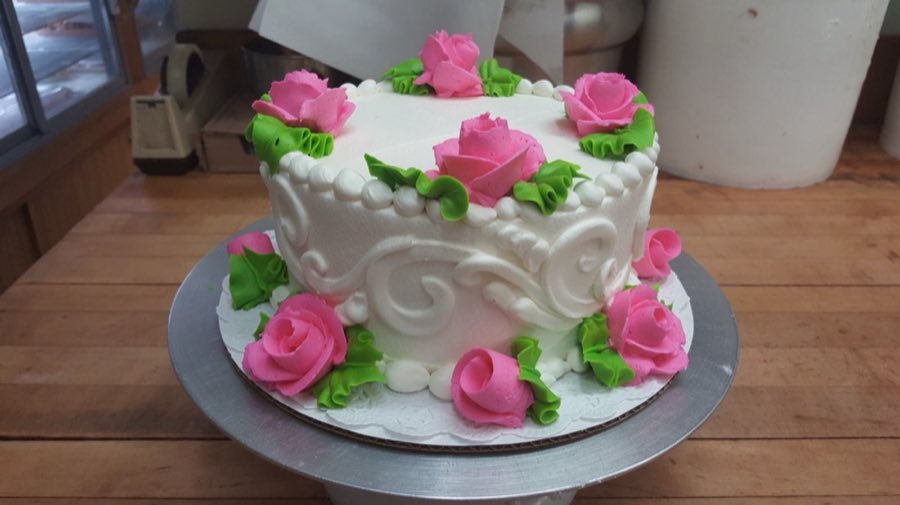 Buttercream cake decorated with pink roses