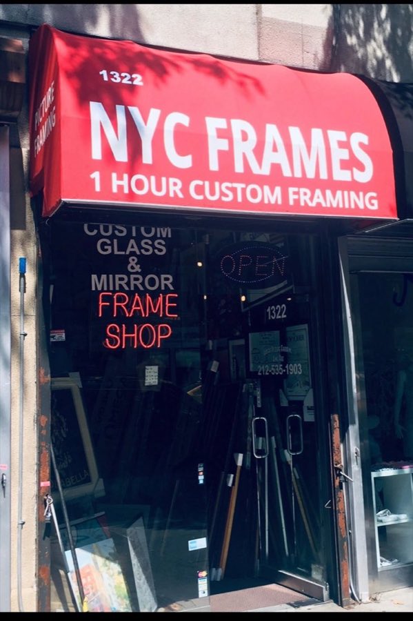 NYC Frames storefront at 1322 3rd Avenue: a red curved awning reading NYC FRAMES, 1 HOUR CUSTOM FRAMING, with neon FRAME SHOP and OPEN signs in the window below