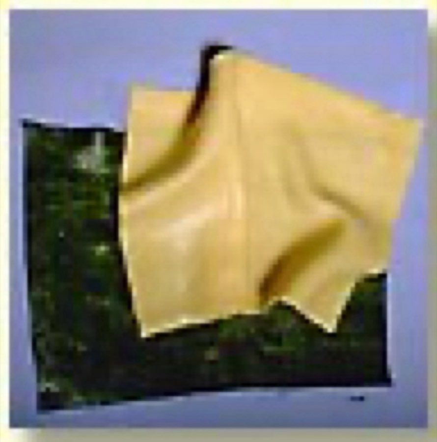 Layered green spinach and yellow egg lasagna sheets
