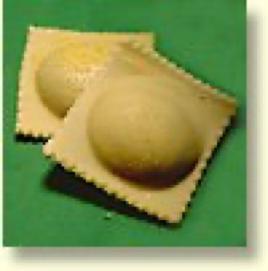 Two large square jumbo ravioli on a yellow background