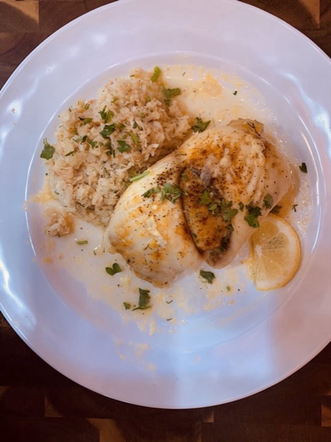 Grilled plate with herb-topped protein, plated for the grill menu