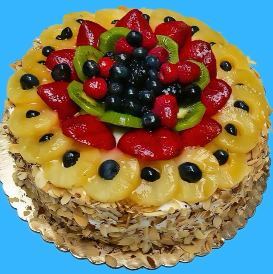 A 10-inch fruit supreme cake topped with strawberries, kiwi, blueberries and raspberries, sides coated in toasted almonds