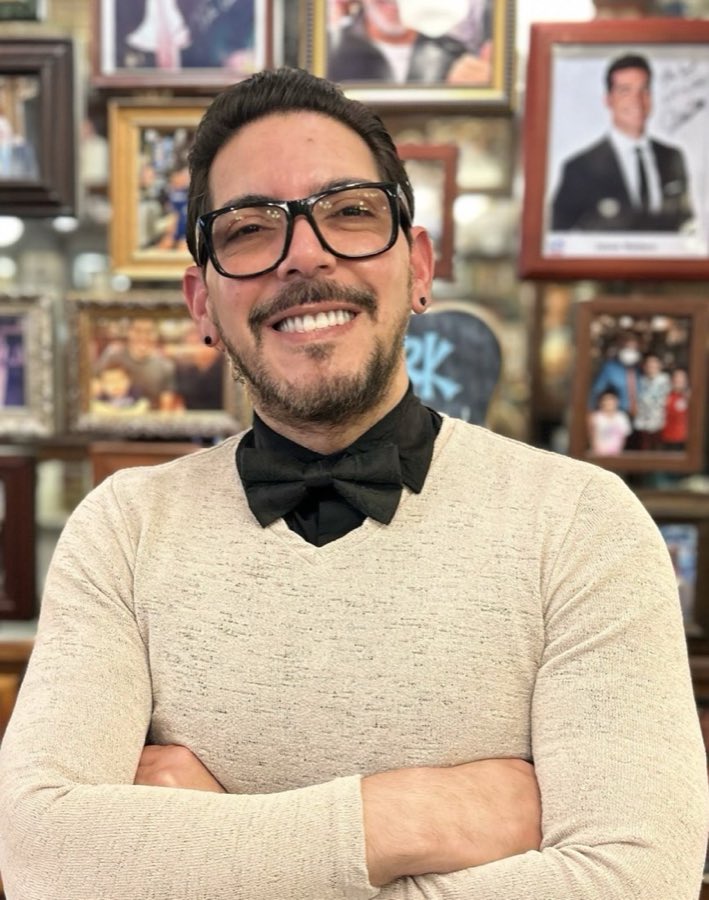 Alex, York Barbershop stylist, wearing glasses and a black bow tie